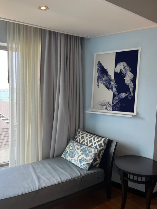 Coming Up for Air humpback whale art print, cream and indigo ocean wall art, shown in a coastal den