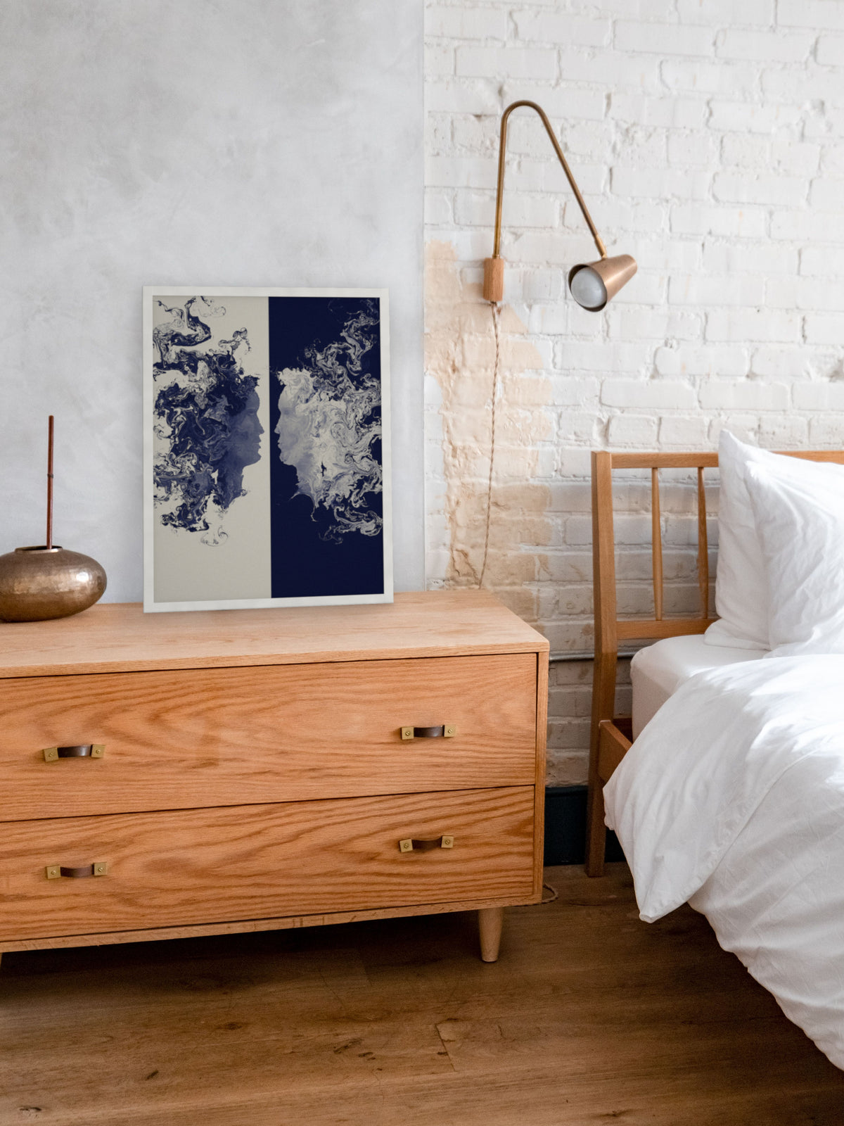 The Space Between two faces art print, cream and indigo romantic wall art, leaning on a dresser