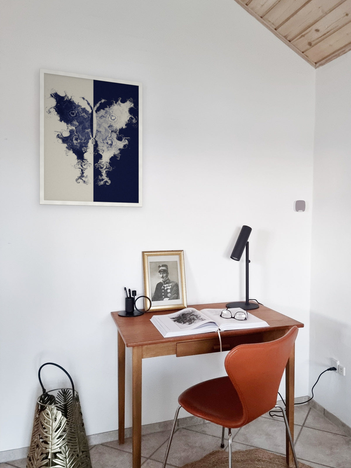 The Fold moth ink blot art print, cream and indigo study wall art, shown in an attic study