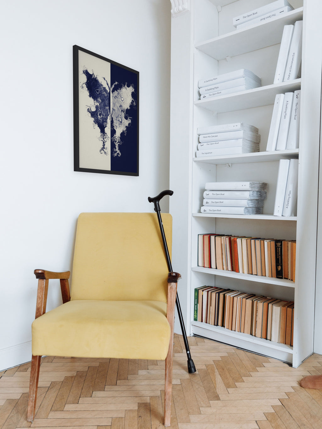 The Fold moth ink blot art print, cream and indigo study wall art, shown in a reading corner