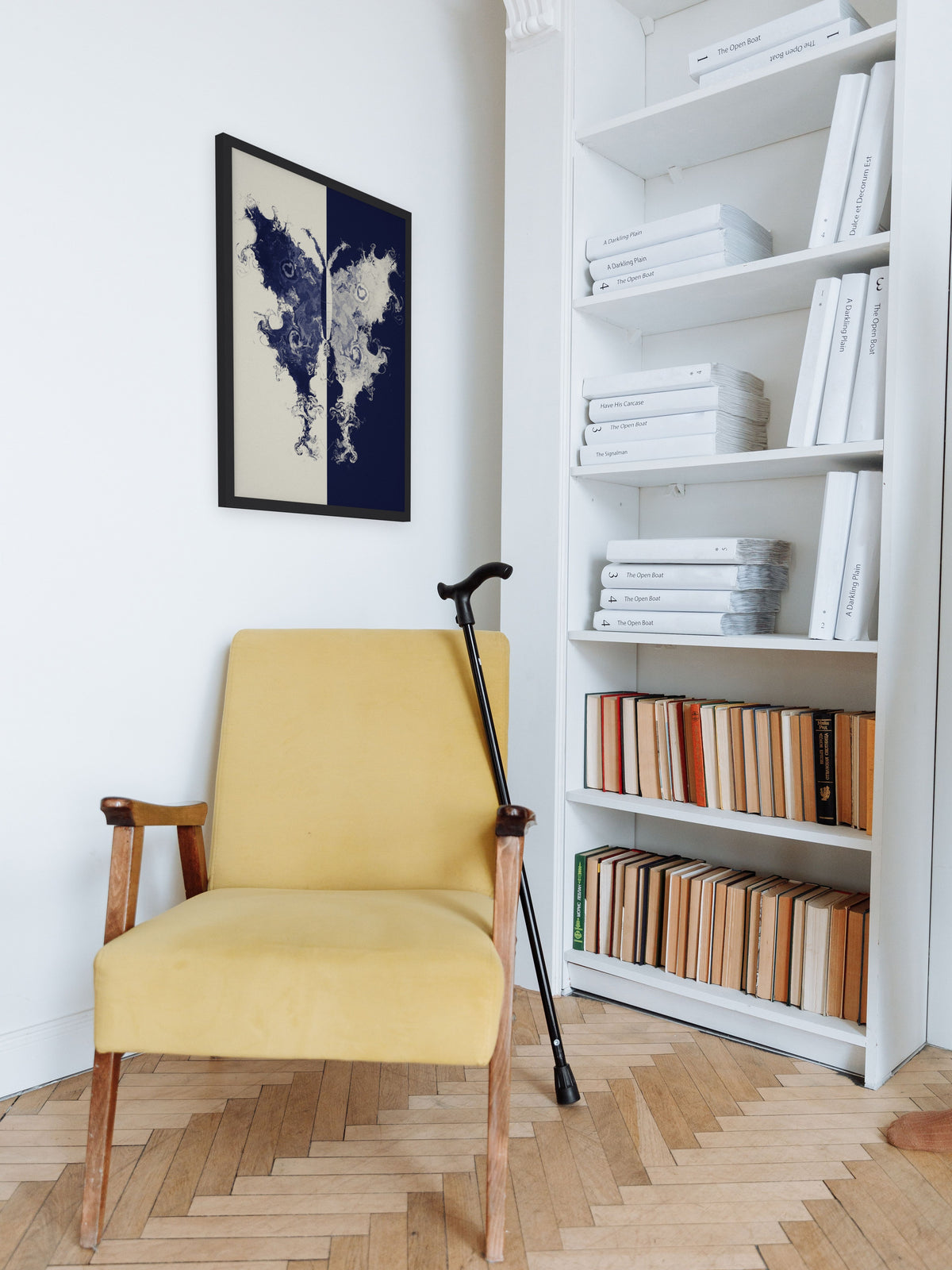 The Fold moth ink blot art print, cream and indigo study wall art, shown in a reading corner