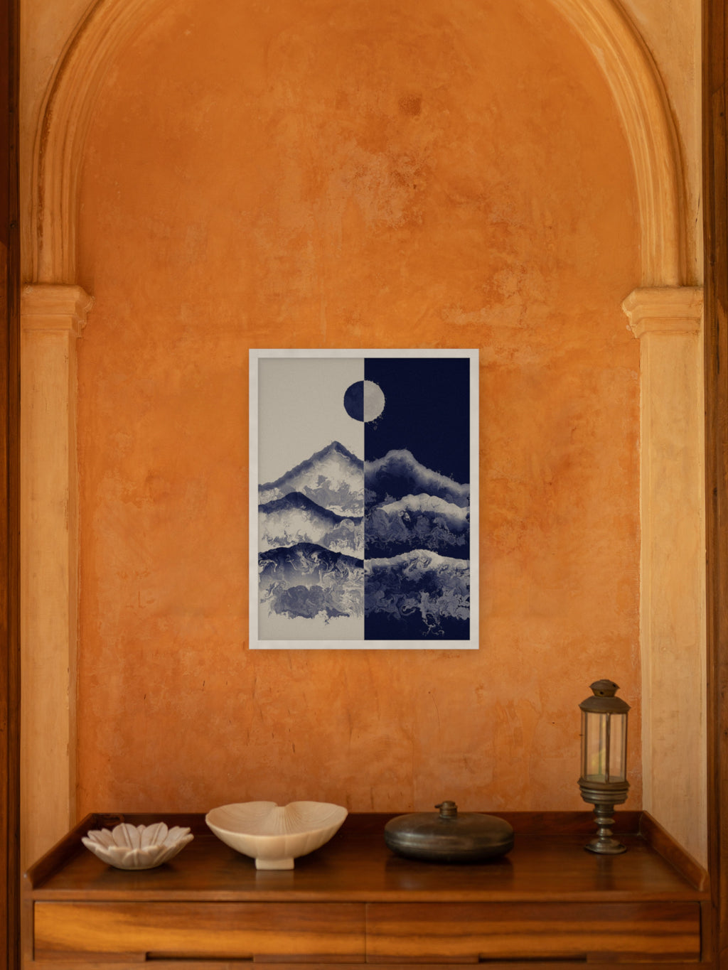Two Skies mountain sun and moon art print, cream and indigo landscape wall art, shown in an entry niche