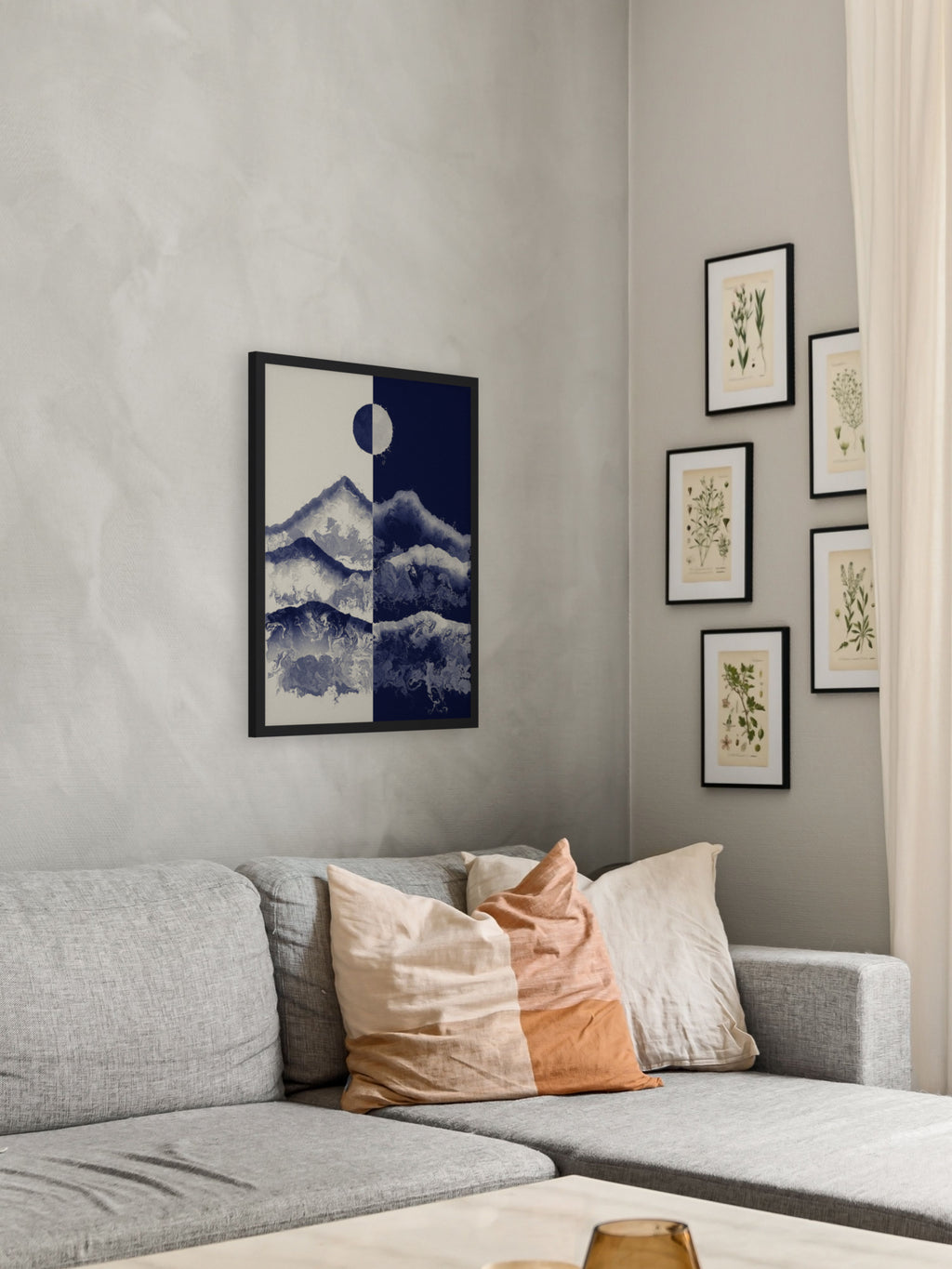 Two Skies mountain sun and moon art print, cream and indigo landscape wall art, shown in a living room