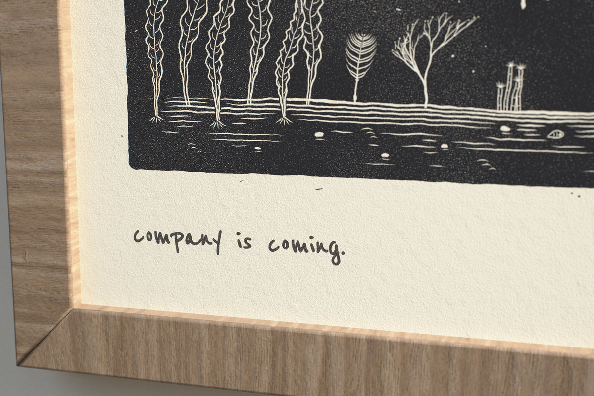 Close-up of the matte archival paper and handwritten caption on the Company Is Coming whale print