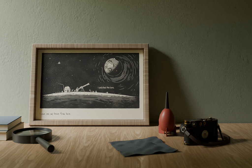 Space wall art in 12x18 above a photographer's desk in morning light