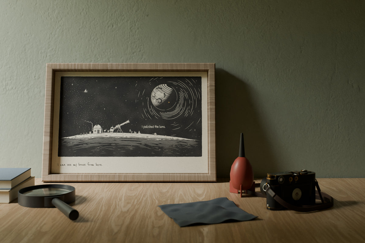 Space wall art in 12x18 above a photographer's desk in morning light