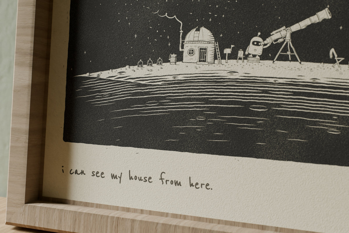 Close-up of the matte archival paper and handwritten caption on the I Can See My House From Here telescope print
