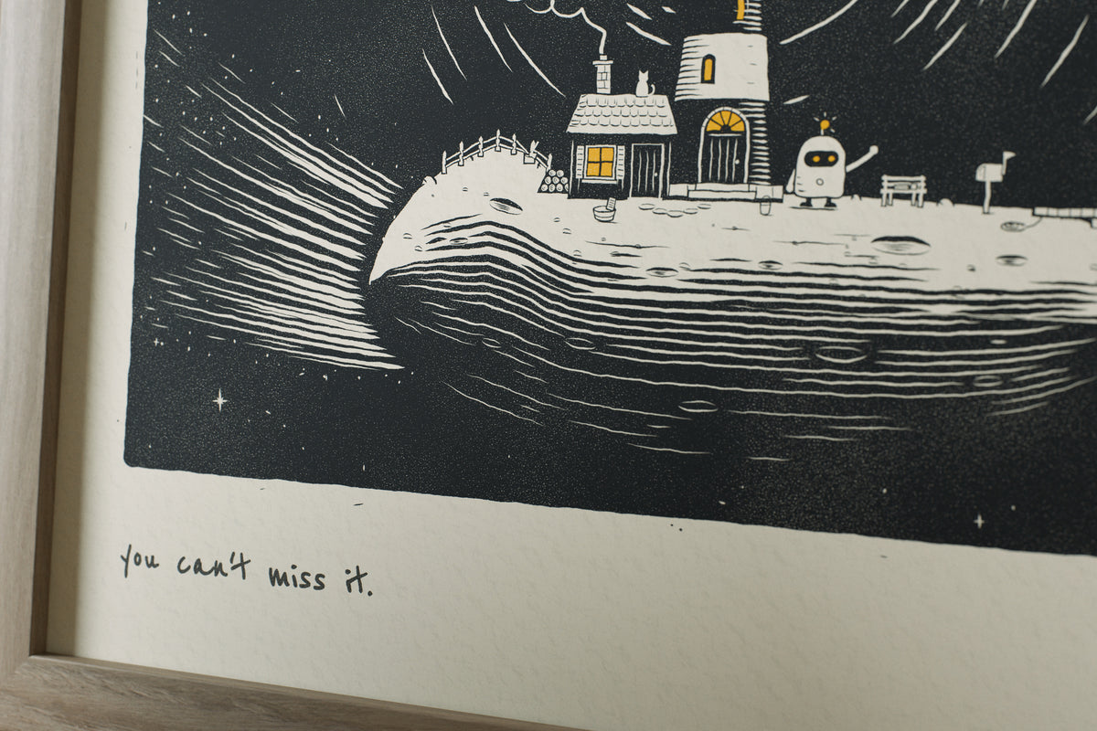 Close-up of the matte archival paper and handwritten caption on the You Can't Miss It lighthouse print